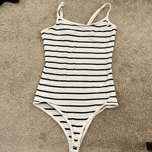 Stripped white and black body suit